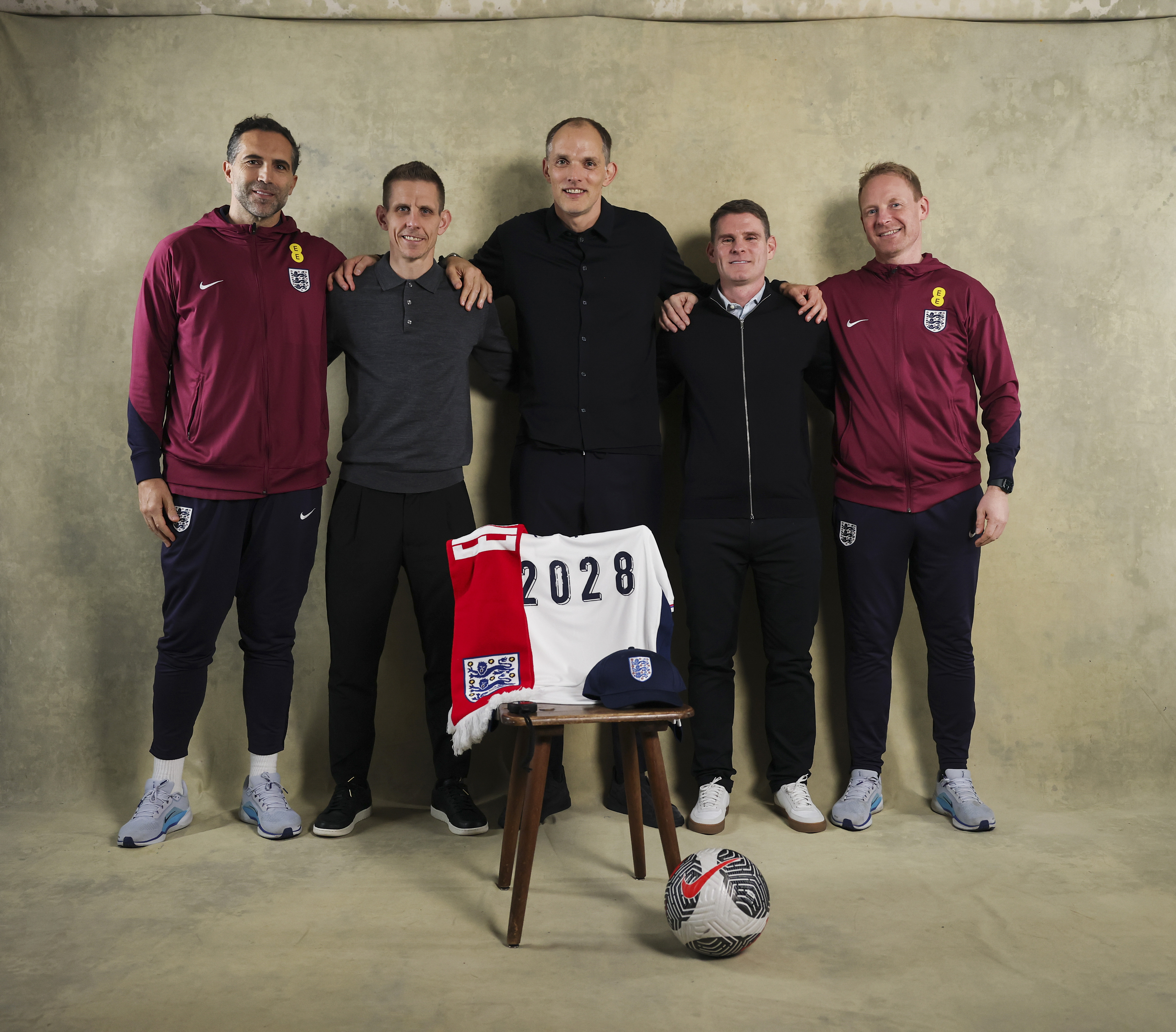 Thomas Tuchel and his England coaching staff pose together, celebrating their contract extensions.