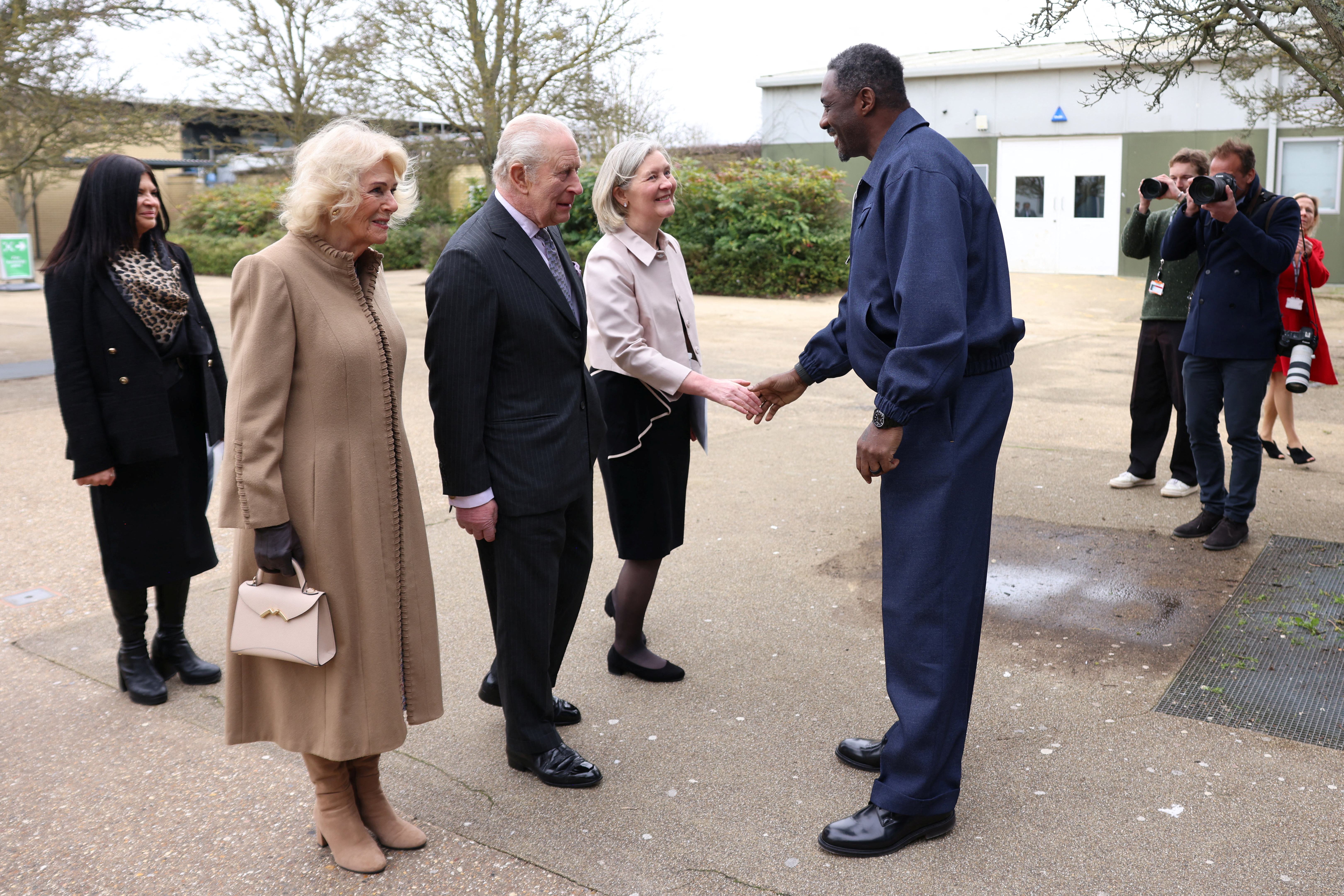King Charles III and Queen Camilla meet with actor Idris Elba and others at Barking and Dagenham College.