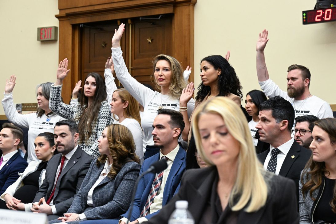 Victims of convicted sex offender Jeffrey Epstein react as US Attorney General Pam Bondi testifies before a House Judiciary Committee hearing on