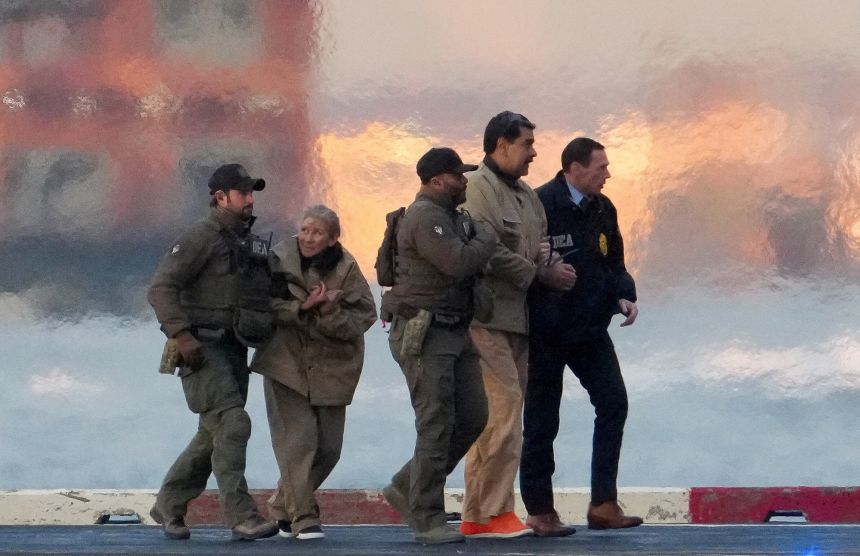 Law enforcement officials move captured Venezuelan President Nicolas Maduro and his wife Cilia Flores toward a courthouse in Manhattan on January 5.