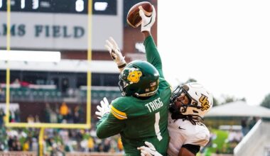 Nov 1, 2025; Waco, Texas, USA; Baylor Bears tight end Michael Trigg (1) catches a touchdown pass as UCF Knights defensive back Braeden Marshall (4) defends during the first half at McLane Stadium. Mandatory Credit: Raymond Carlin III-Imagn Images
