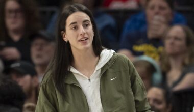Aug 24, 2025; Minneapolis, Minnesota, USA; Indiana Fever guard Caitlin Clark (22) looks on from the bench against the Minnesota Lynx in the second half at Target Center. Mandatory Credit: Jesse Johnson-Imagn Images