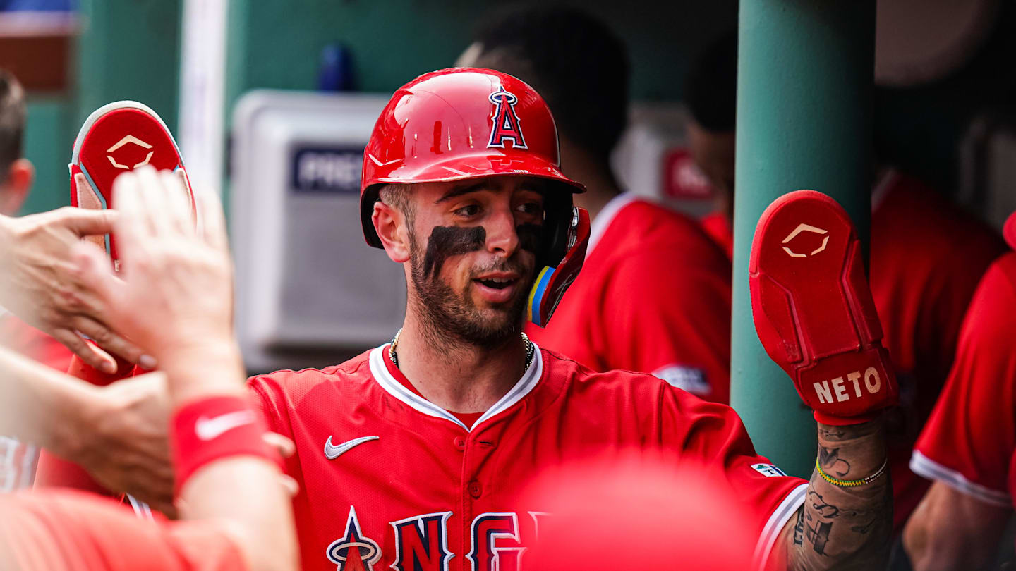 Jun 4, 2025; Boston, Massachusetts, USA; Los Angeles Angels shortstop Zach Neto (9) is congratulated after scoring against the Boston Red Sox in the second inning at Fenway Park. Mandatory Credit: David Butler II-Imagn Images