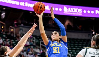 UCLA's Lauren Betts, center, shoots between Michigan State's Ines Sotelo, left, and Grace VanSlooten during the first quarter on Wednesday, Feb. 11, 2026, at the Breslin Center in East Lansing.