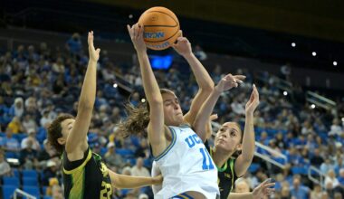 Dec 7, 2025; Los Angeles, California, USA;  UCLA Bruins guard Gabriela Jaquez (11) is defended by Oregon Ducks guard Janiyah Williams (22) and guard Katie Fiso (2) as she drives to the basket during the first half at Pauley Pavilion presented by Wescom Financial. Mandatory Credit: Jayne Kamin-Oncea-Imagn Images