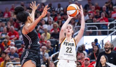Jul 9, 2025; Indianapolis, Indiana, USA; Indiana Fever guard Caitlin Clark (22) shoots the ball while Golden State Valkyries forward Monique Billings (25) defends in the first half at Gainbridge Fieldhouse. Mandatory Credit: Trevor Ruszkowski-Imagn Images
