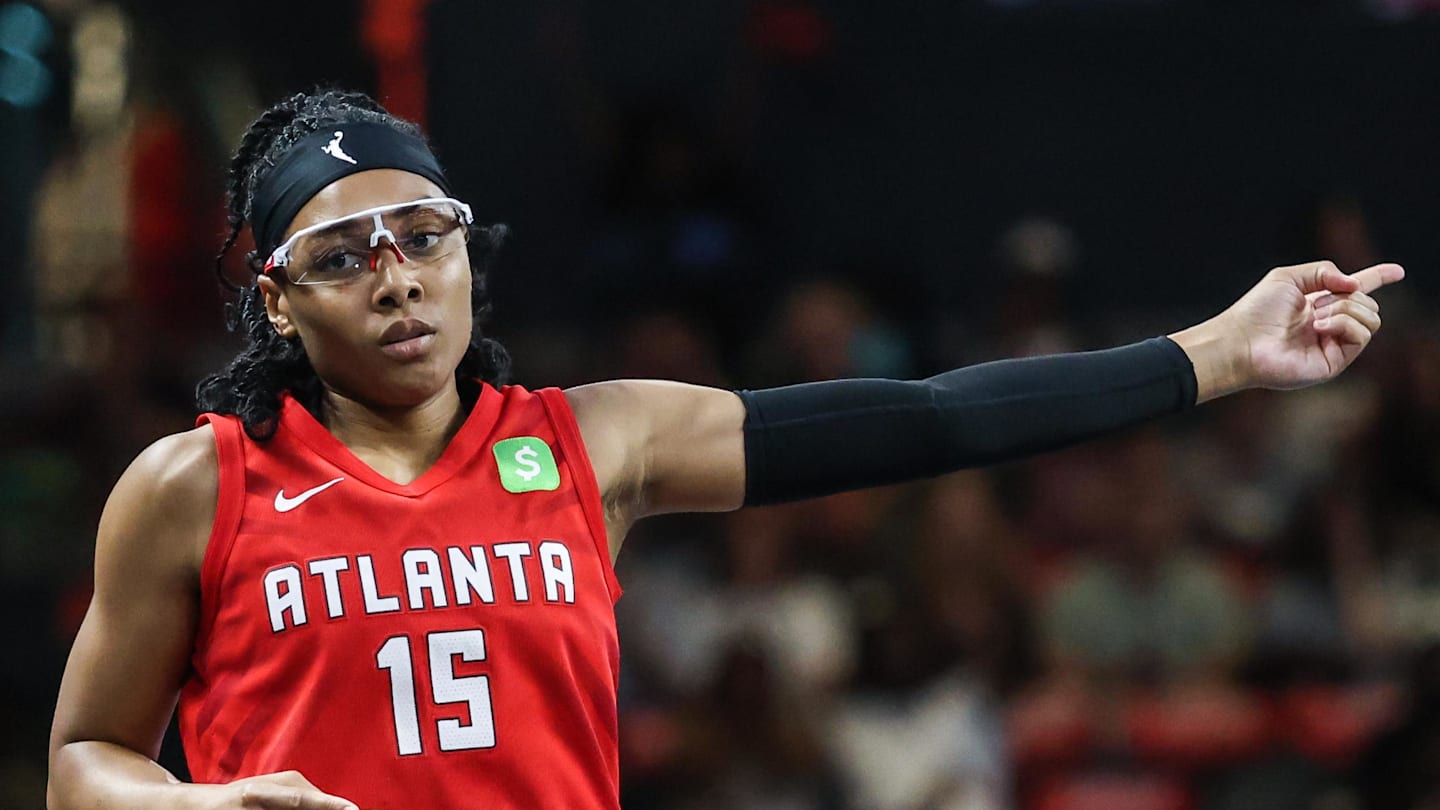 Aug 23, 2025; College Park, Georgia, USA; Atlanta Dream guard Allisha Gray (15) celebrates a three point shot against the New York Liberty during the first quarter at Gateway Center Arena at College Park. Mandatory Credit: Jordan Godfree-Imagn Images
