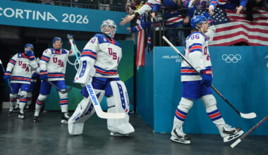 Feb 22, 2026; Milan, Italy; Jake Oettinger (30) of United States heads to the ice with teammates for warmups before playing against Canada in the men's ice hockey gold medal game during the Milano Cortina 2026 Olympic Winter Games at Milano Santagiulia Ice Hockey Arena. Mandatory Credit: Amber Searls-Imagn Images