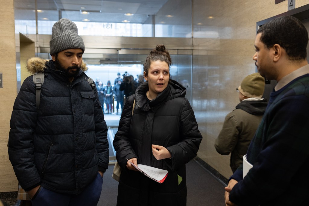 Presbyterian nurses bargaining committee leader Beth Loudin delivers a letter signed by over 1,000 striking nurses expressing their opposition to a contract deal agreed upon by NYSNA union leaders without their knowledge,