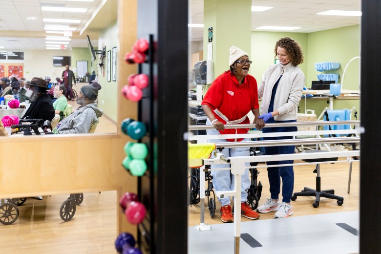 Physical therapist Leslie McIntyre assists Connie Young in mobility exercises inside the rehabilitation center at the Thome Rivertown Senior Apartments facility in Detroit, Michigan, on Tuesday, Feb. 17, 2026.