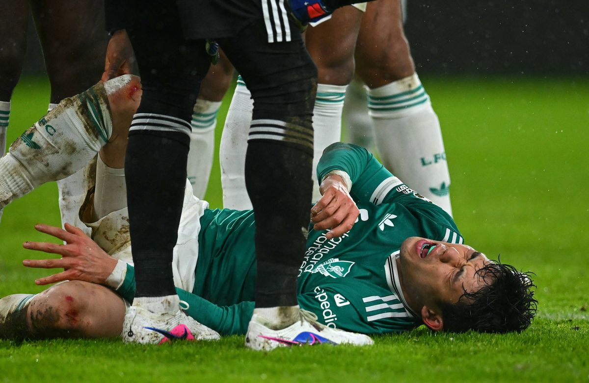 Liverpool's Japanese midfielder #03 Wataru Endo lays on the pitch injured during the English Premier League football match between Sunderland and Liverpool at The Stadium of Light in Sunderland in north east England on February 11, 2026. (Photo by ANDY BUCHANAN / AFP via Getty Images) / RESTRICTED TO EDITORIAL USE. No use with unauthorized audio, video, data, fixture lists, club/league logos or 'live' services. Online in-match use limited to 120 images. An additional 40 images may be used in extra time. No video emulation. Social media in-match use limited to 120 images. An additional 40 images may be used in extra time. No use in betting publications, games or single club/league/player publications. /