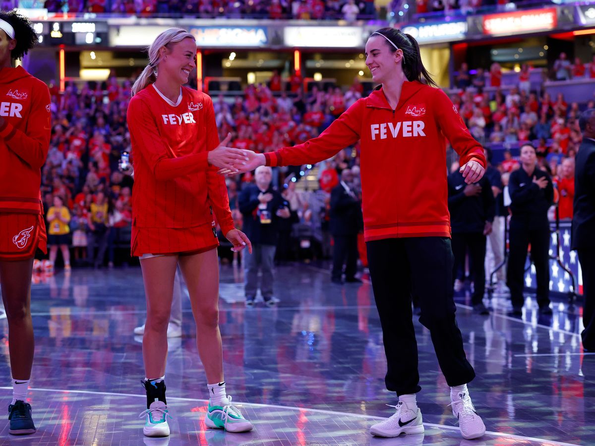 Sophie Cunningham and Caitlin Clark shake hands before a WNBA game 