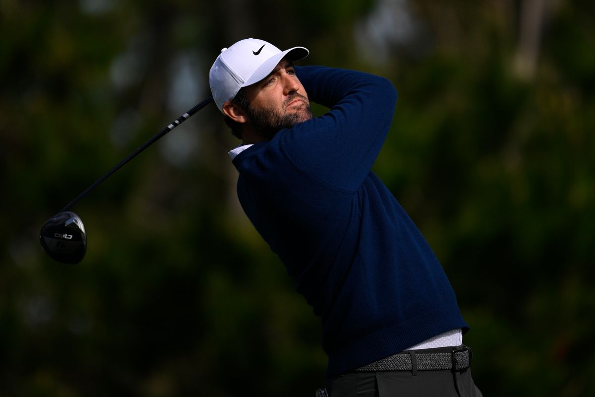 Scottie Scheffler swings a golf club
