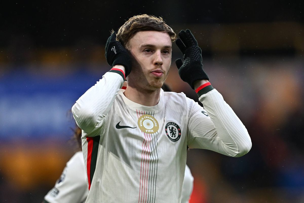 Cole Palmer celebrates scoring his team's first goal from the penalty spot during the Premier League match between Wolverhampton Wanderers and Chelsea at Molineux. 