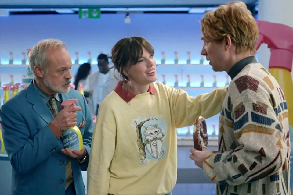 Graham Norton, Taylor Swift, and Domhnall Gleeson in her 'Opalite' music video. Taylor Swift/Apple Music