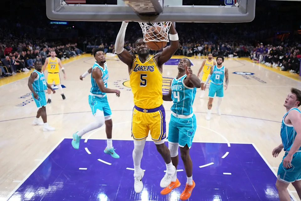 Jan 15, 2026; Los Angeles, California, USA; Los Angeles Lakers center Deandre Ayton (5) dunks the ball against Charlotte Hornets forward Moussa Diabate (14) in the first half at Crypto.com Arena. Mandatory Credit: Kirby Lee-Imagn Images