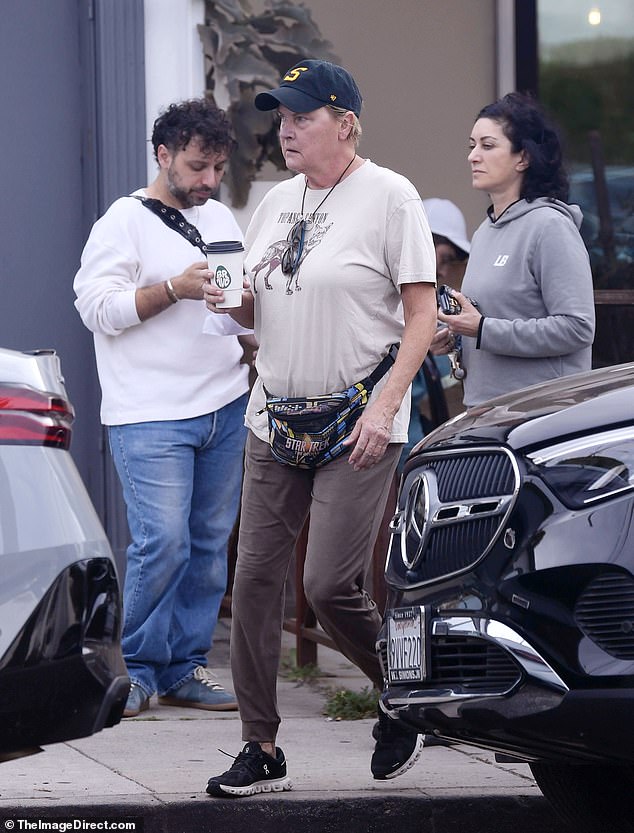 The 68-year-old actress, who won legions of fans as Security Chief Tasha Yar on Star Trek: The Next Generation, seemed in high spirits as she grabbed a drink while running errands around the city