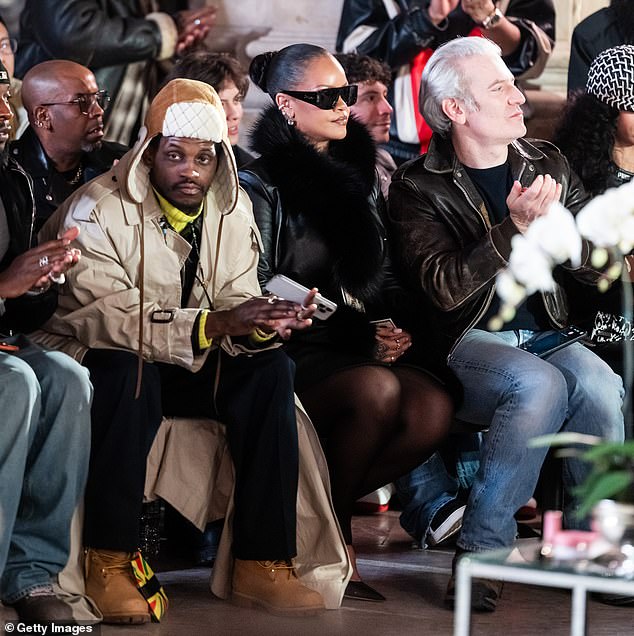 Rihanna was clearly captivated by she saw behind her stylish shades