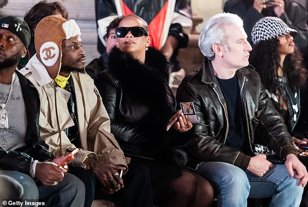 Rihanna looked proud to be among the throng of people who got first looks at Rocky's new lineup