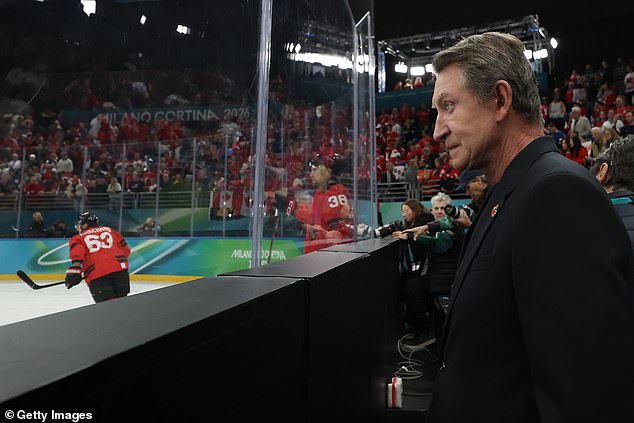 Canadian hockey icon Wayne Gretzky watches on as the teams warm up in Italy