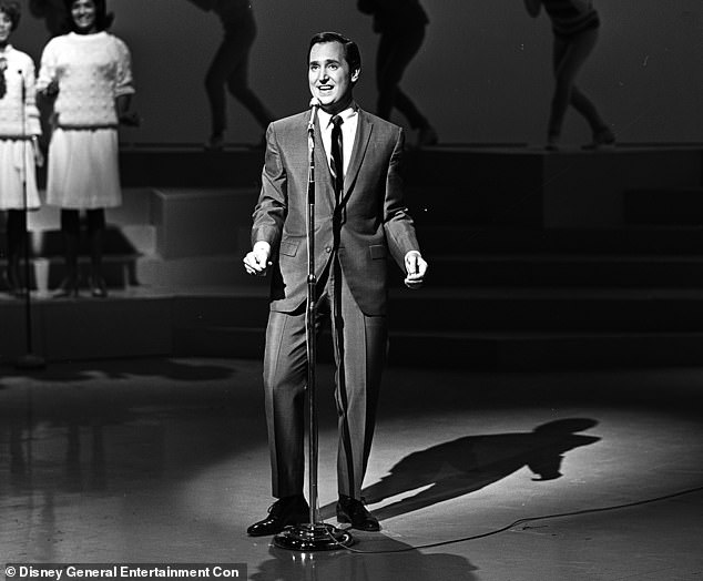 Famed 1960s and 1970s singer Neil Sedaka was reportedly rushed to a hospital in Los Angeles on Friday morning before his death at age 86; seen in 1964