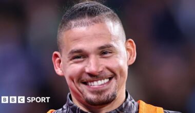 Kalvin Phillips smiling while warming up for Manchester City