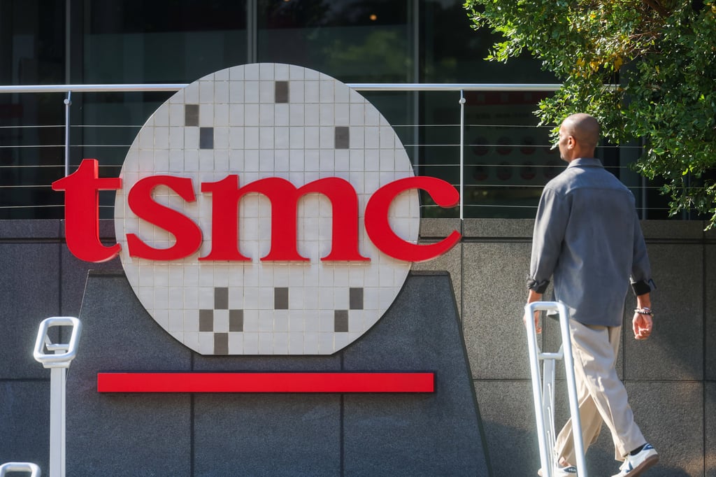 A worker walks past the TSMC logo in Hsinchu, Taiwan, in January. Photo: AP