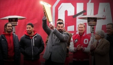 Ohio State coach Ryan Day hoists the championship trophy during the school's national championship celebration at Ohio Stadium in Columbus on Jan. 26, 2025.