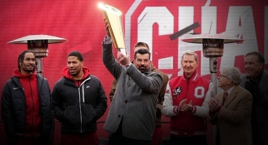 Ohio State coach Ryan Day hoists the championship trophy during the school's national championship celebration at Ohio Stadium in Columbus on Jan. 26, 2025.