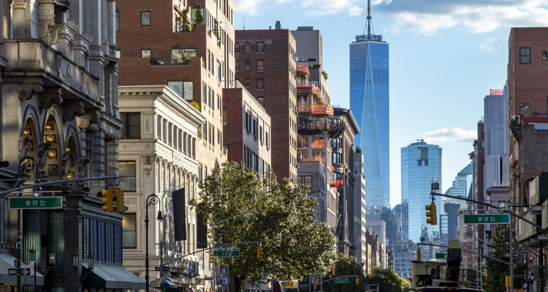 View of the historic buildings along 6th Avenue towards downtown Manhattan in New York City NYC.