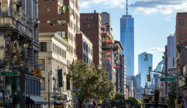 View of the historic buildings along 6th Avenue towards downtown Manhattan in New York City NYC.