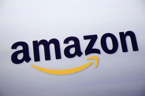 The Amazon logo is displayed at a news conference in New York on Sept. 28, 2011. (AP Photo/Mark Lennihan, File)