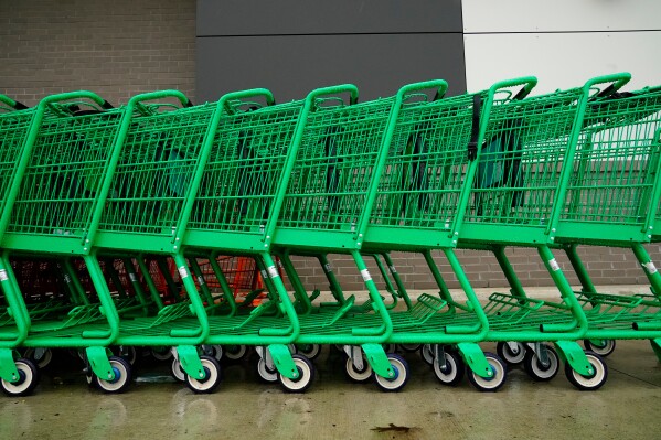 Shopping carts are positioned outside an Amazon Fresh grocery store in Warrington, Pa., Feb. 4, 2022. (AP Photo/Matt Rourke, File)