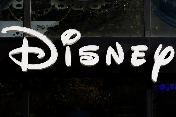 The Disney logo is seen on their store along the Champs Elysees Avenue in Paris on Sept. 20, 2017. (AP Photo/Francois Mori, File)