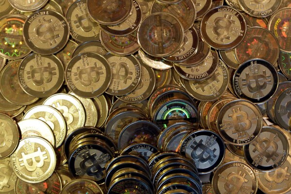 Bitcoin tokens are seen on April 3, 2013, in Sandy, Utah. (AP Photo/Rick Bowmer, File)