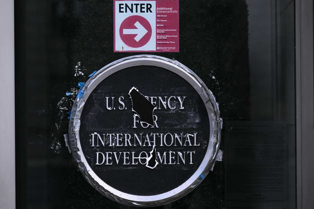 Remnants of signage for the US Agency for International Development (USAID) on the facade of the Ronald Reagan Building and International Trade Center building in Washington, DC, on December 29, 2025.