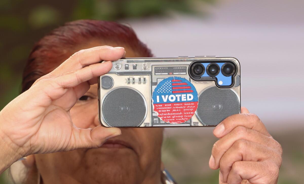 Nithya Raman, right, arrives with her chief of staff Andrea Conant to file paperwork to run for mayor