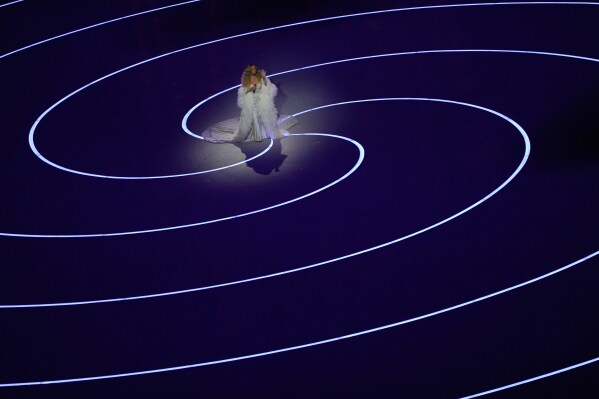 Singer Mariah Carey performs during the Olympic opening ceremony at the 2026 Winter Olympics, in Milan, Italy, Friday, Feb. 6, 2026. (AP Photo/Francisco Seco)