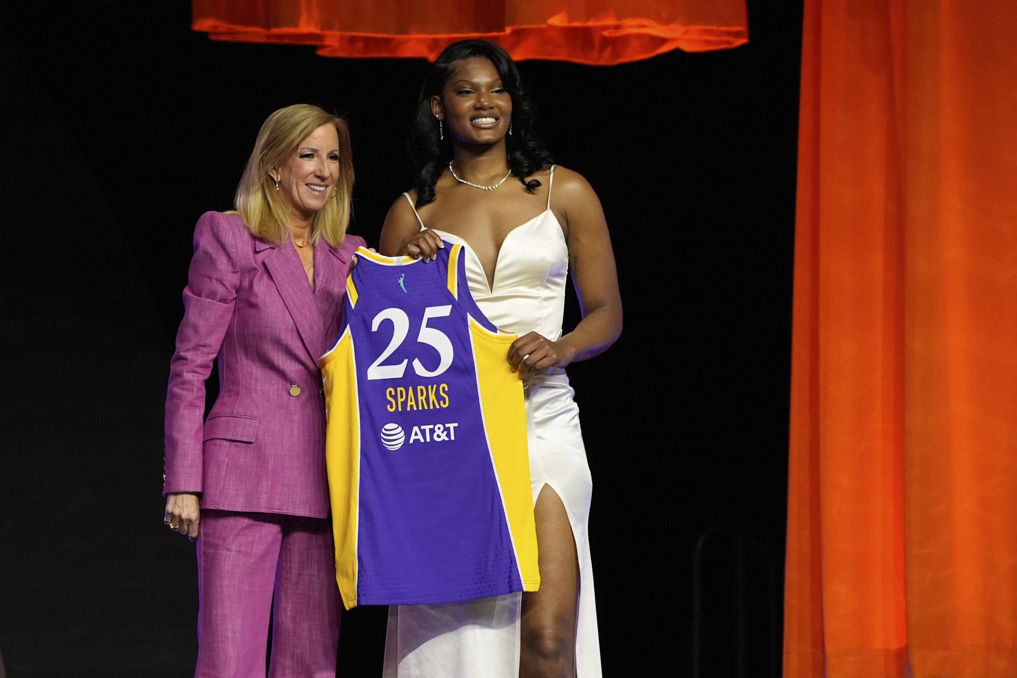 Sania Feagin, right, poses for a photo with WNBA commissioner Cathy Engelbert.