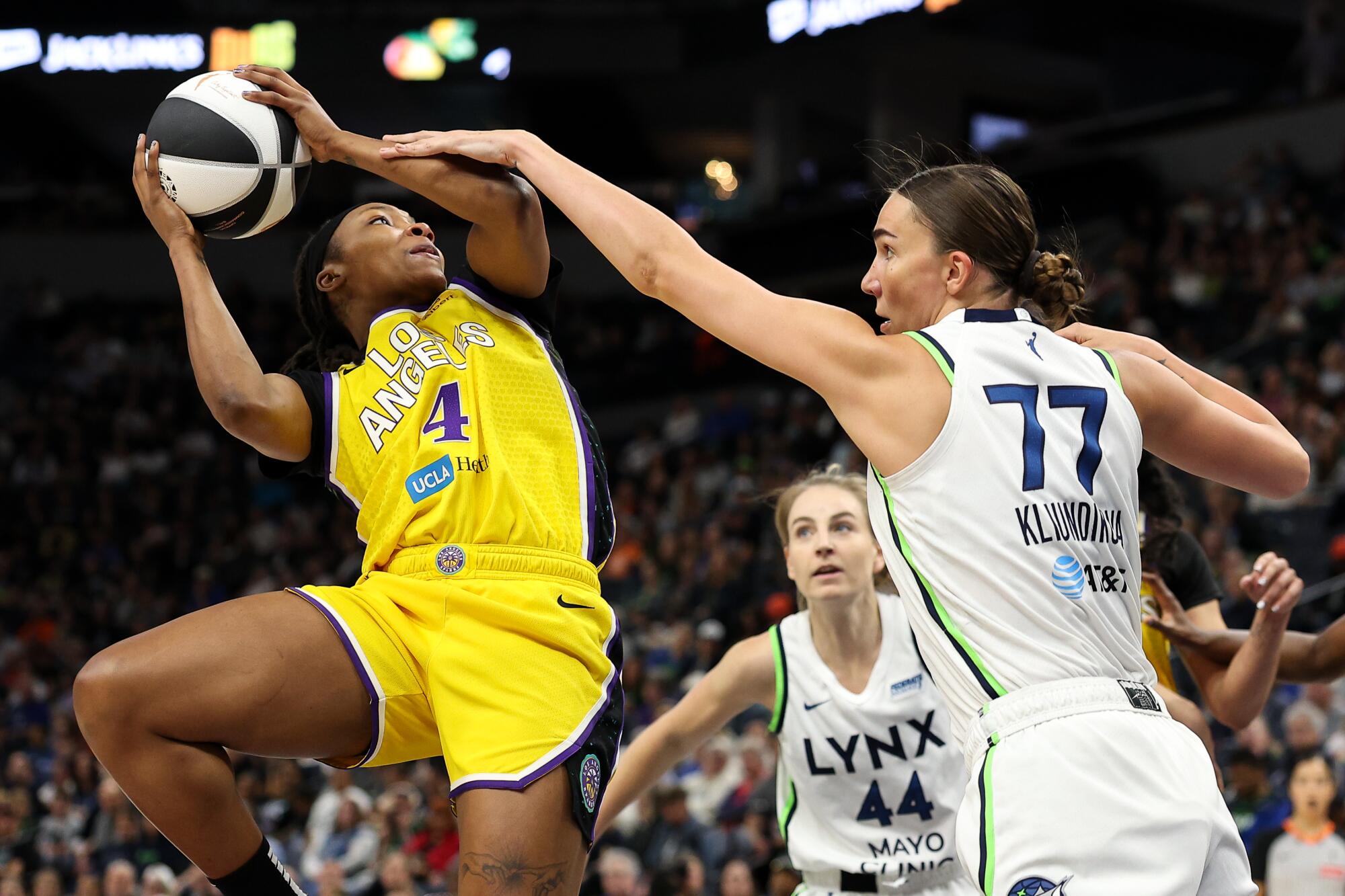 Sparks guard Liatu King shoots over Minnesota's Maria Kliundikova during a game on June 14.