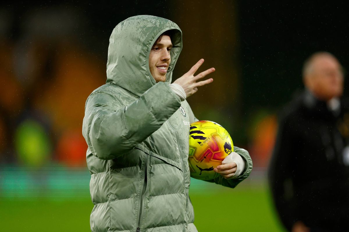 Cole Palmer celebrates his hat-trick following the Premier League match between Wolverhampton Wanderers and Chelsea at Molineux. 