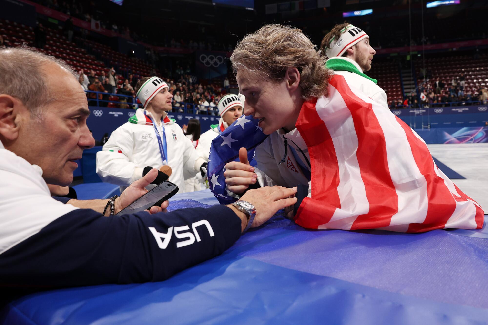 Gold medalist Ilia Malinin celebrates after the medal ceremony at the Milano-Cortina Winter Games at Milano Ice Skating Arena