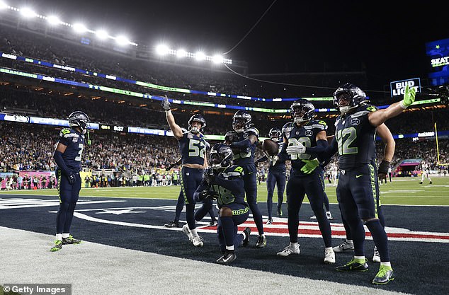 SANTA CLARA, CALIFORNIA - FEBRUARY 08: Tyrice Knight #48 of the Seattle Seahawks, Julian Love #20 of the Seattle Seahawks, Patrick O'Connell #52 of the Seattle Seahawks, Drake Thomas #42 of the Seattle Seahawks, Nick Emmanwori #3 of the Seattle Seahawks celebrate after an interception during the second half of Super Bowl LX at Levi's Stadium against the New England Patriots on February 08, 2026 in Santa Clara, California. (Photo by Kathryn Riley/Getty Images)