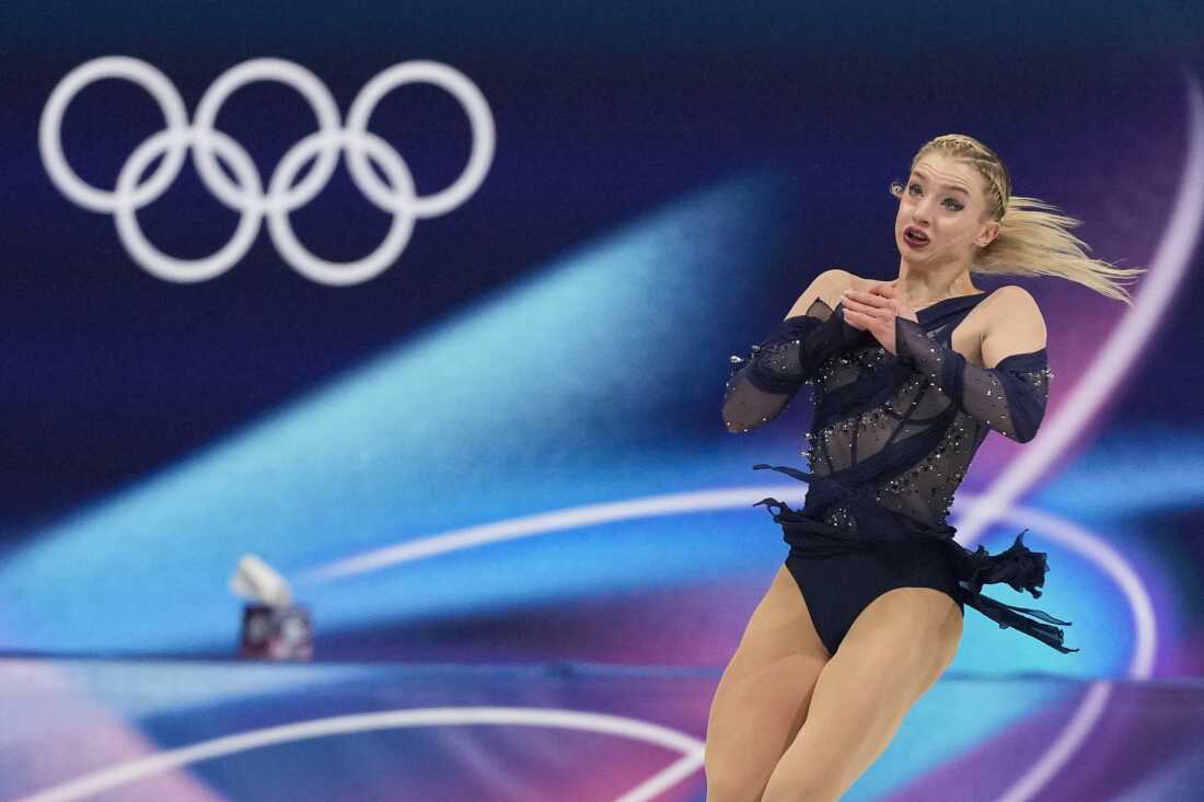 Amber Glenn of the United States competes during the figure skating women's team event at the 2026 Winter Olympics, in Milan, Italy, Sunday, Feb. 8, 2026. Glenn says she's received online hate and threats for speaking out in support of LGBTQ rights in Milan.