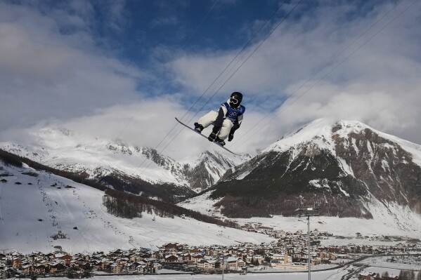 Japan's Ryusei Yamada practices during a snowboarding halfpipe training session at the 2026 Winter Olympics, in Livigno, Italy, Tuesday, Feb. 10, 2026. (AP Photo/Gregory Bull)
