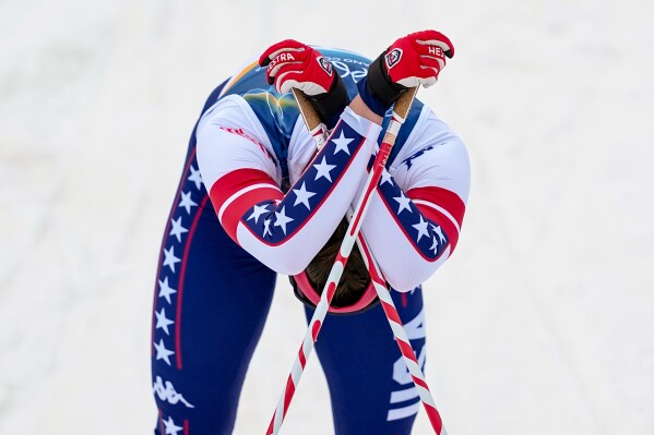 Julia Kern, of the United States reacts after crossing the finish line in a semifinal of the cross-country skiing women's sprint classic at the 2026 Winter Olympics, in Tesero, Italy, Tuesday, Feb. 10, 2026. (AP Photo/Matthias Schrader)