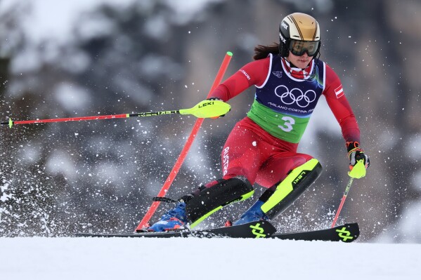 Austria's Katharina Huber speeds down the course during an alpine ski, slalom portion of a women's team combined race, at the 2026 Winter Olympics, in Cortina d'Ampezzo, Italy, Tuesday, Feb. 10, 2026. (AP Photo/Marco Trovati)