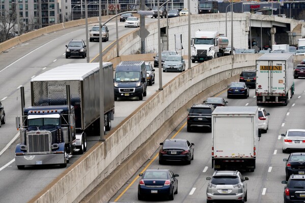 Motor vehicle traffic moves along the Interstate 76 highway in Philadelphia, March 31, 2021. (AP Photo/Matt Rourke, File)