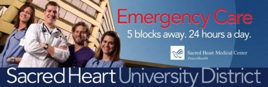 A billboard picturing healthcare professionals