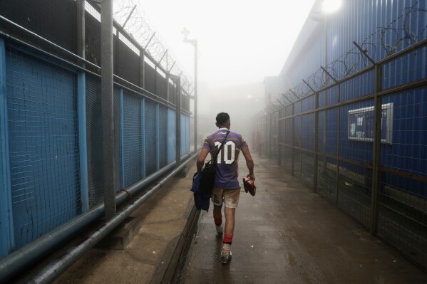 An inmate walks off the field after playing rugby at the Valparaiso Prison Complex in Valparaiso, Chile, as part of a social reintegration program, Jan. 29, 2026. (AP Photo/Cristobal Escobar, File)